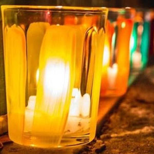 visuel représentant un lumignon allumé le soir du 8 décembre 